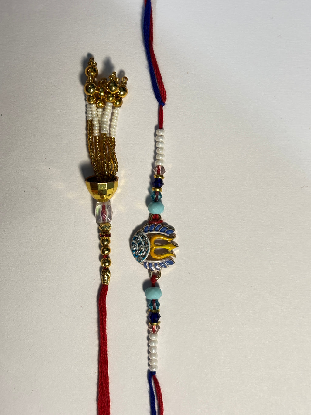 Spiritual Trishul & Gold Tassel Bhaiya Bhabhi Rakhi Set (Pair of 2)