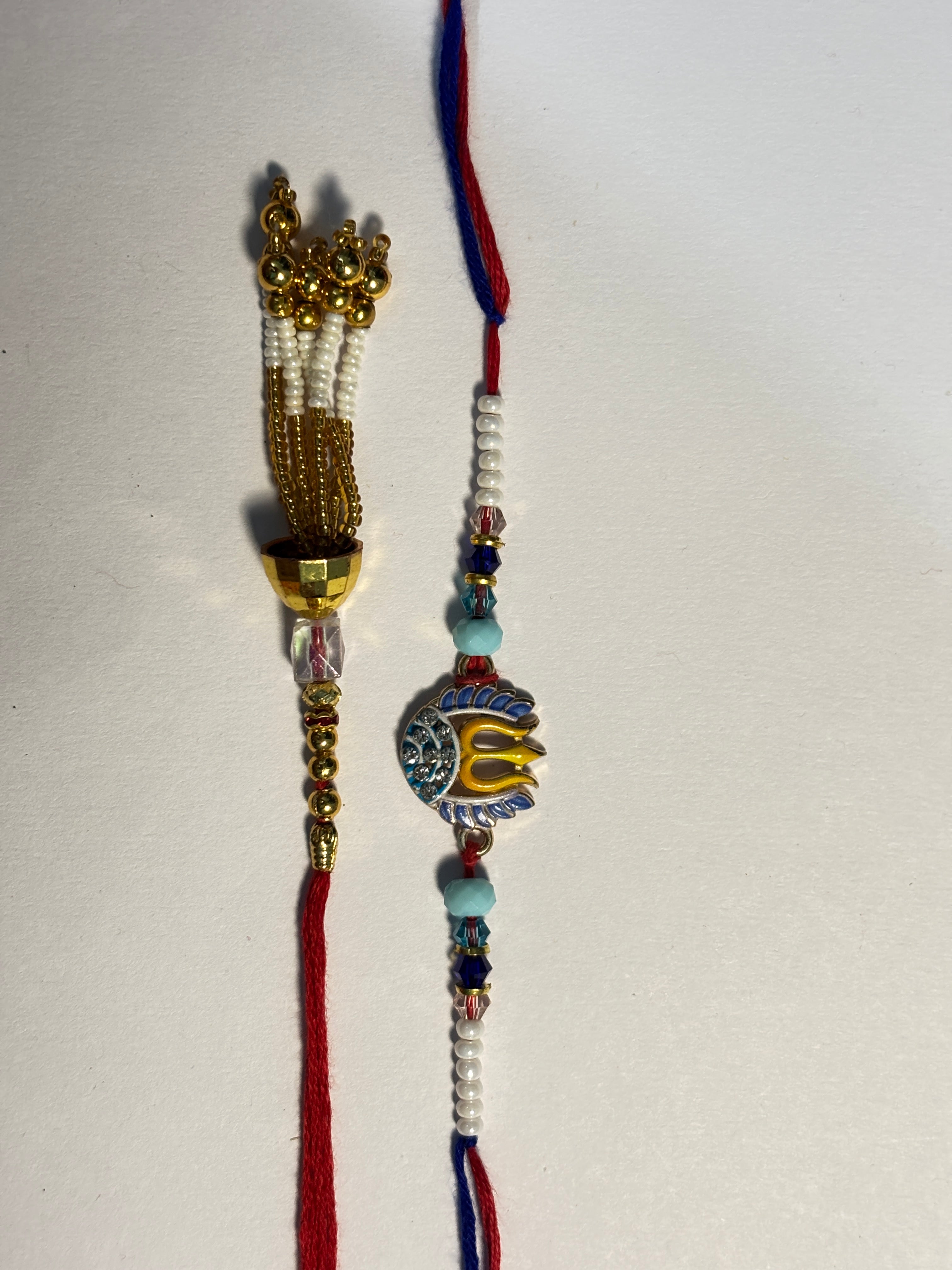Spiritual Trishul & Gold Tassel Bhaiya Bhabhi Rakhi Set (Pair of 2)